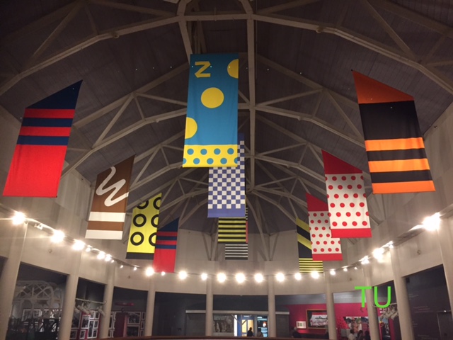 Banners in the silk colors of the 12 Triple Crown Winners